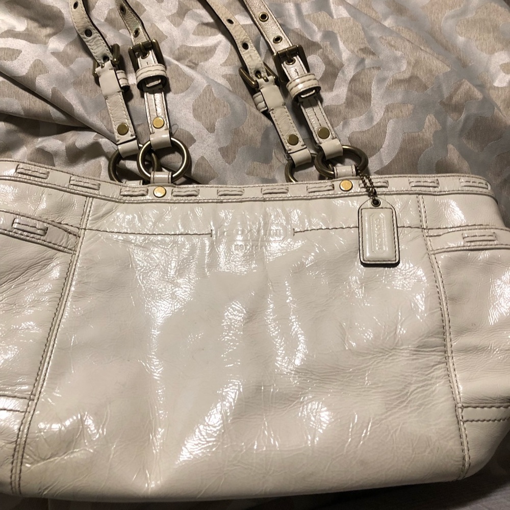 Cream, patent leather Coach bag. GUC